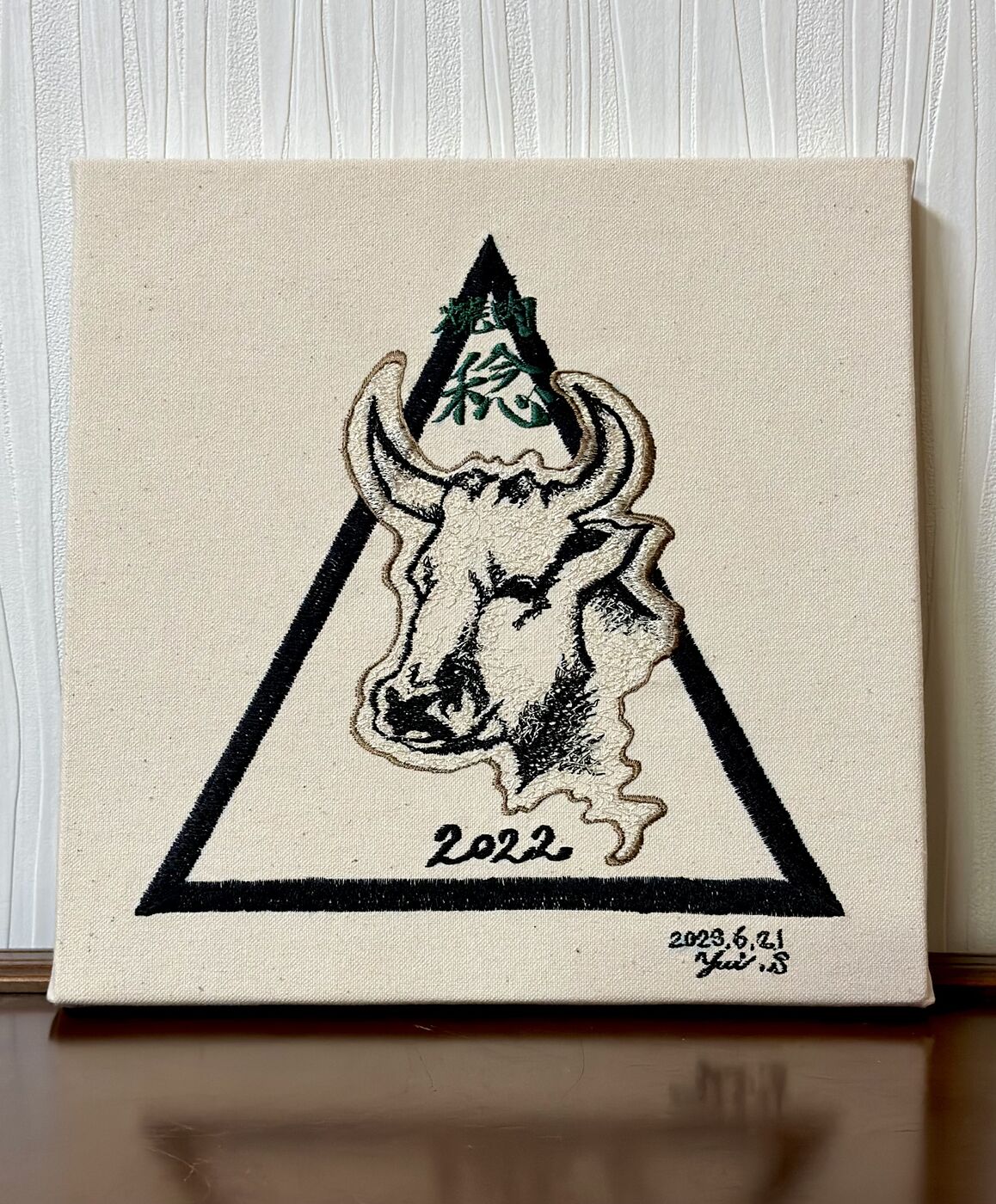 Embroidered canvas, flower and hand (sample)